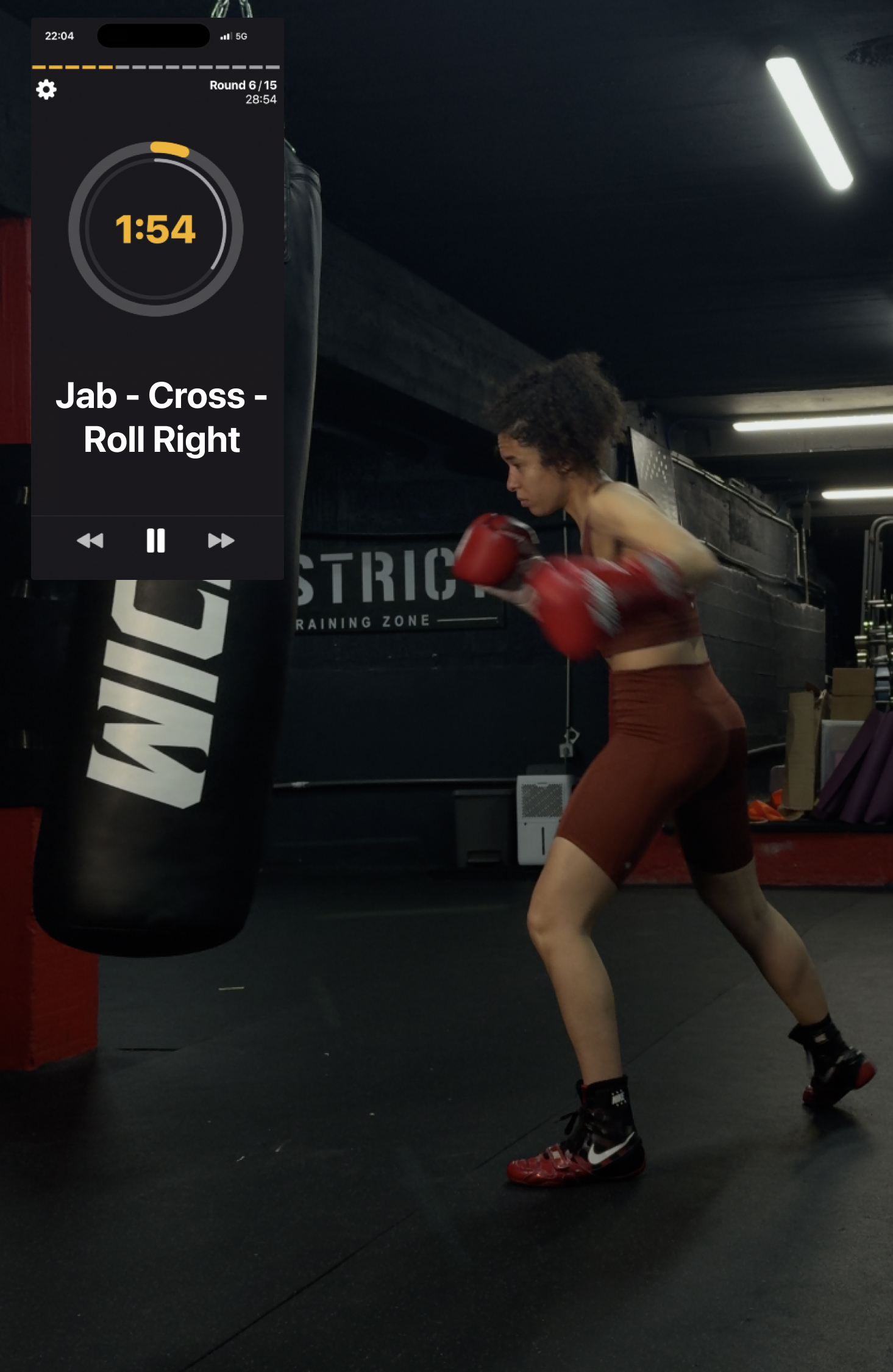 Someone training on the punching bag with the boxing app