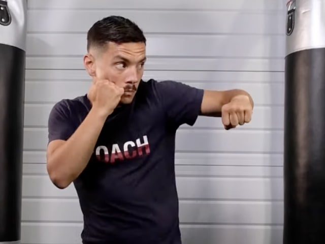Boxer throwing a hook, from the full hook tutorial